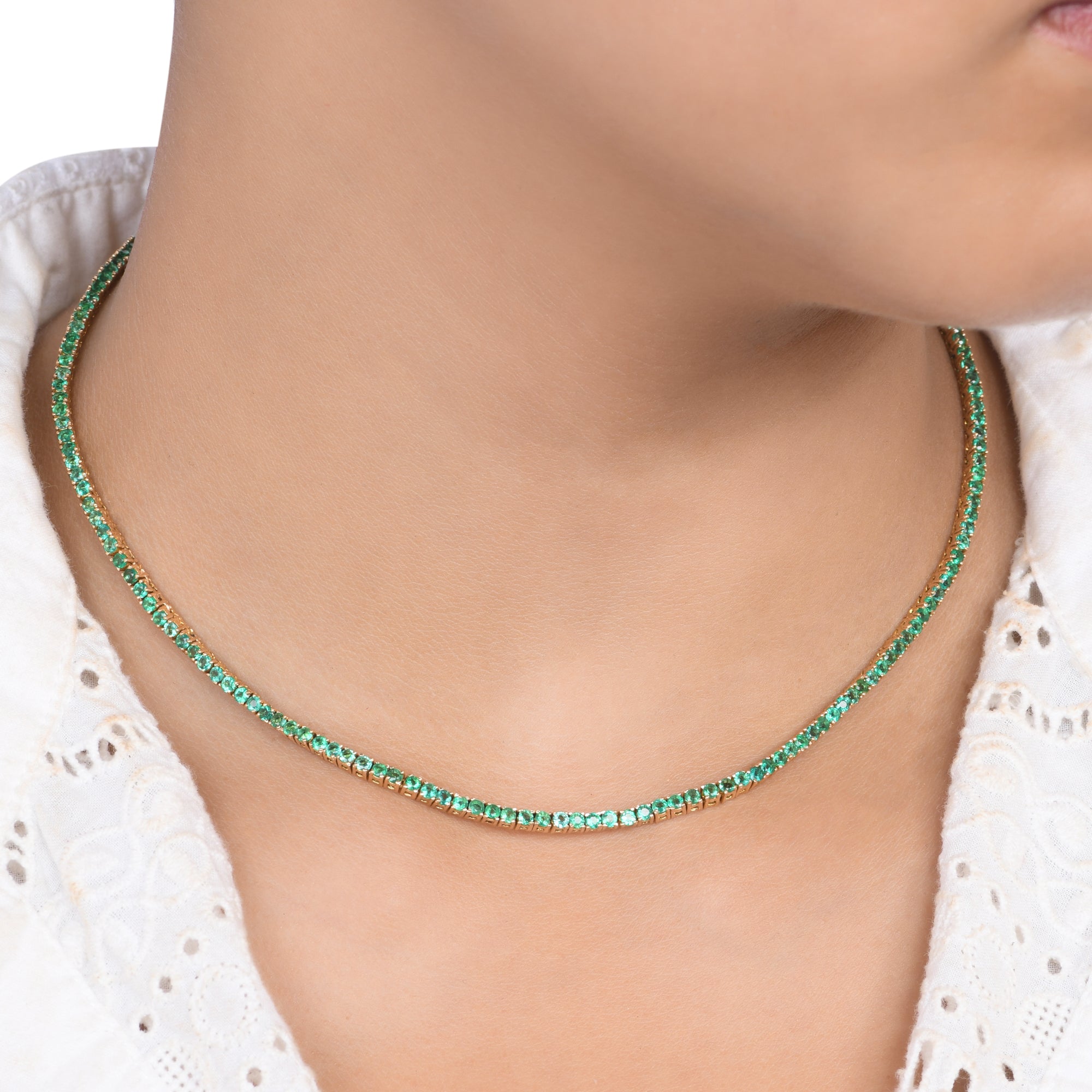18kt yellow gold tennis necklace with emeralds